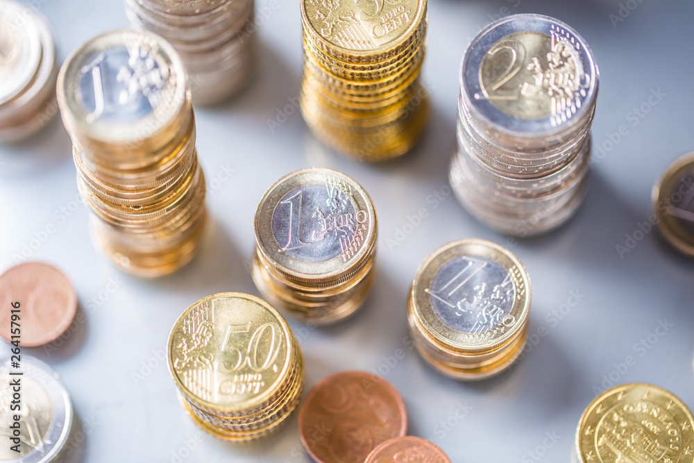 Towers of the euro coins stacked in different positions Towers of the euro coins stacked in different positions