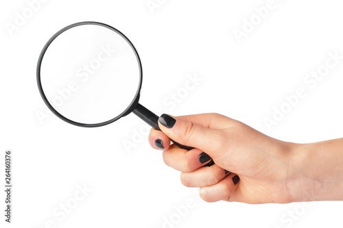 Magnifying glass in a woman hand isolated on white background