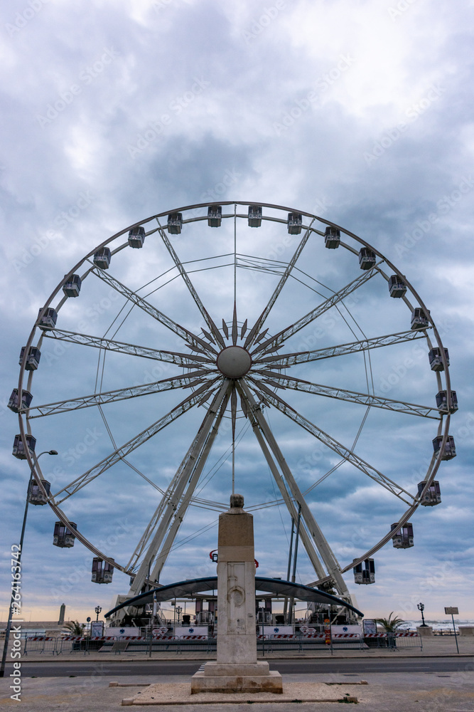 Italy, Bari, Ferris wheel on the waterfront. 