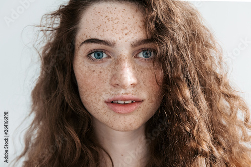 Bild auf Leinwand Beautiful Freckles young woman close up portrait