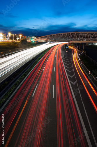 highway at night with headlights of cars