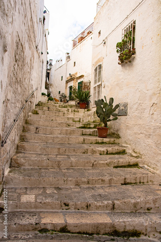 Italy, Ostuni, a typical street in the ancient historic center © benny