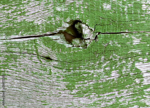 Old wooden background with remains of pieces of scraps of old paint on wood. Texture of an old tree, vintage wood background peeling paint. old blue board with cracked paint