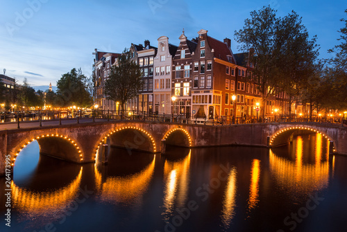 light up bridges over canals of Amsterdam at blue hour