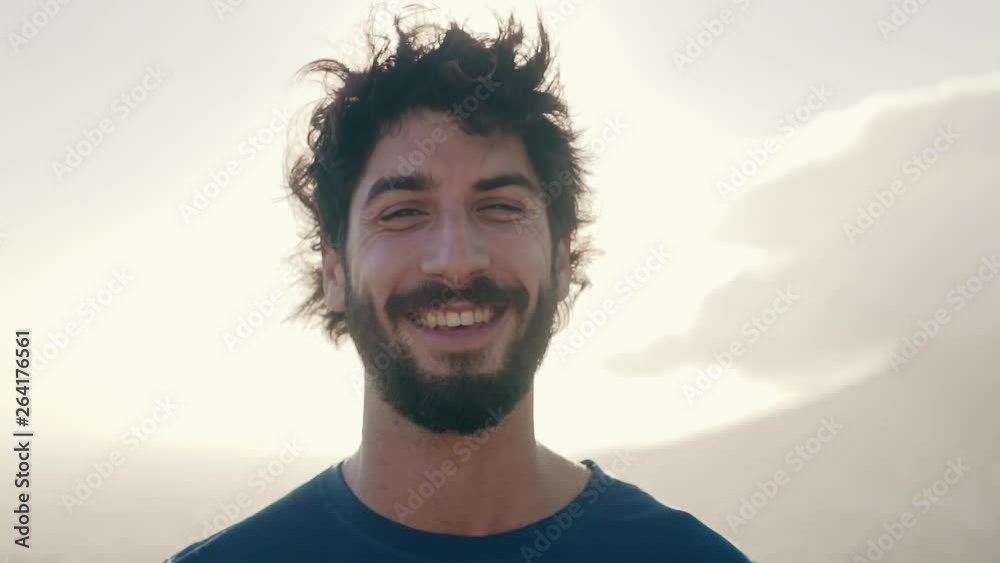 Portrait of a cheerful young man on sunny day