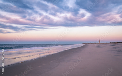 Cape May, NJ, beach and ocean provides beautiful calming sunrise in violet hues on an early spring morning
