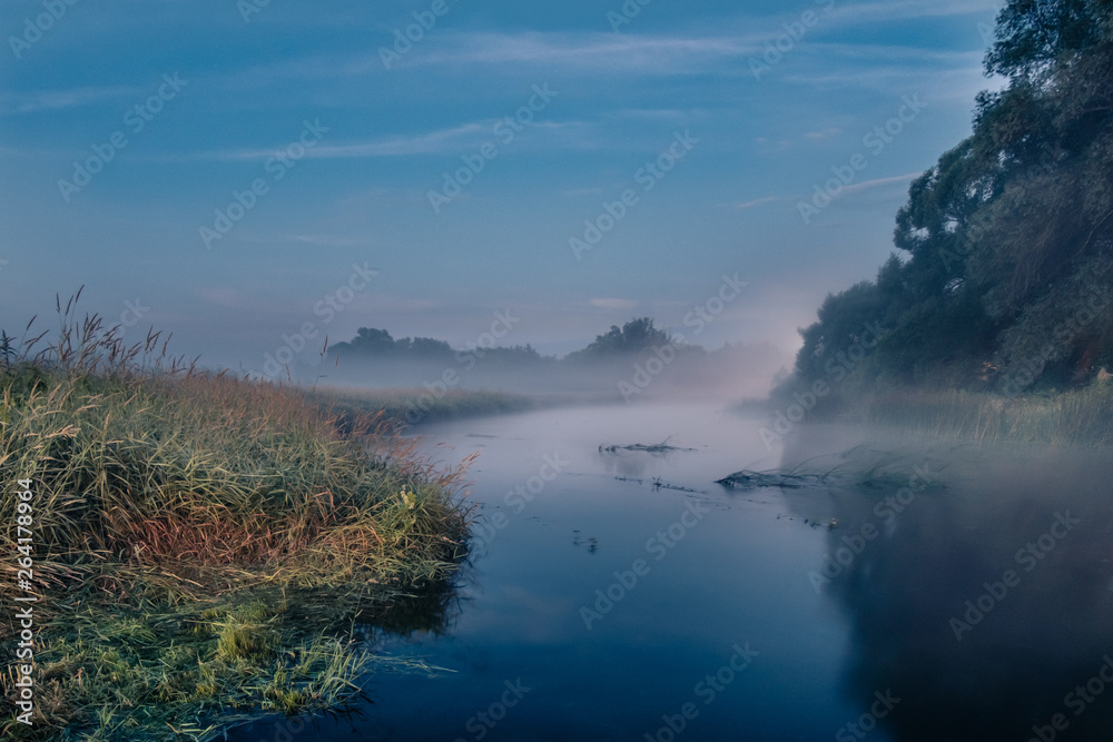 Fog at dusk on the river in the early morning