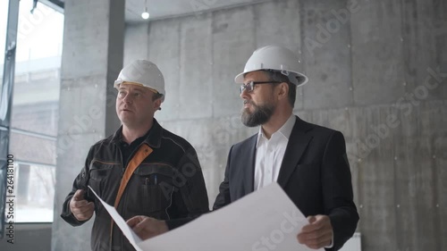 Two Engineers Meet At Construction And Consult Building Project. Two Engineers. 4k