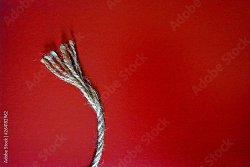 Minimalism on red background with rope