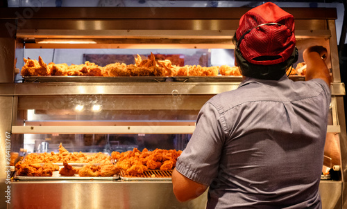Minimum Wage Employee Works in a Fast Food Kitchen. photo