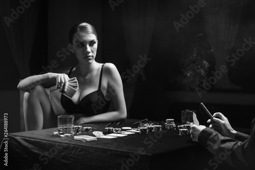 Beautiful woman playing naked poker