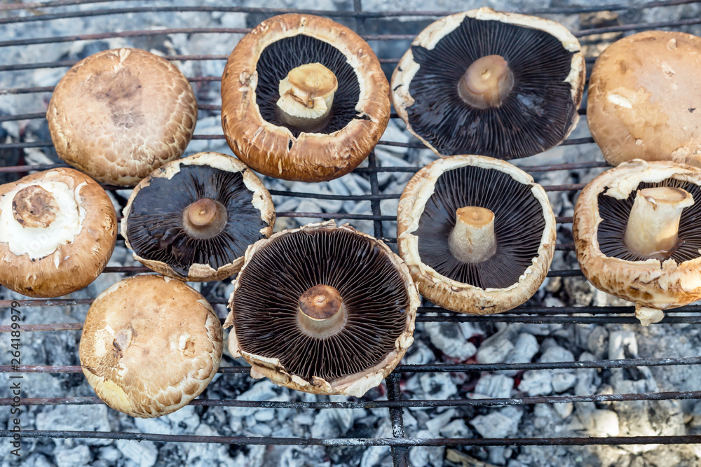 Cooking mushrooms on charcoal close-up