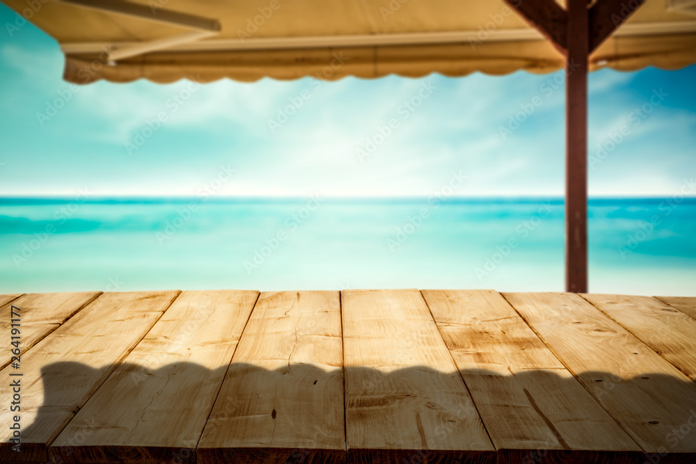Fototapeta premium Desk of free space and summer beach with umberlla