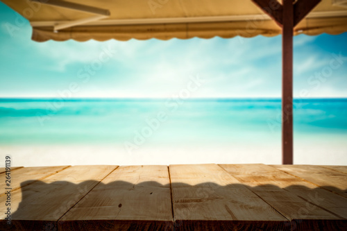 Fototapeta Naklejka Na Ścianę i Meble -  Desk of free space and summer beach with umberlla 