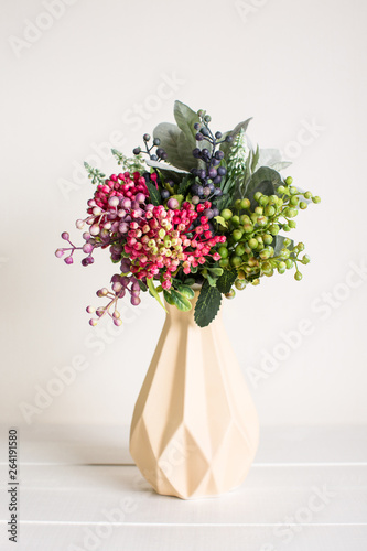 Various artificial flowers  bouquets in vases  succulents