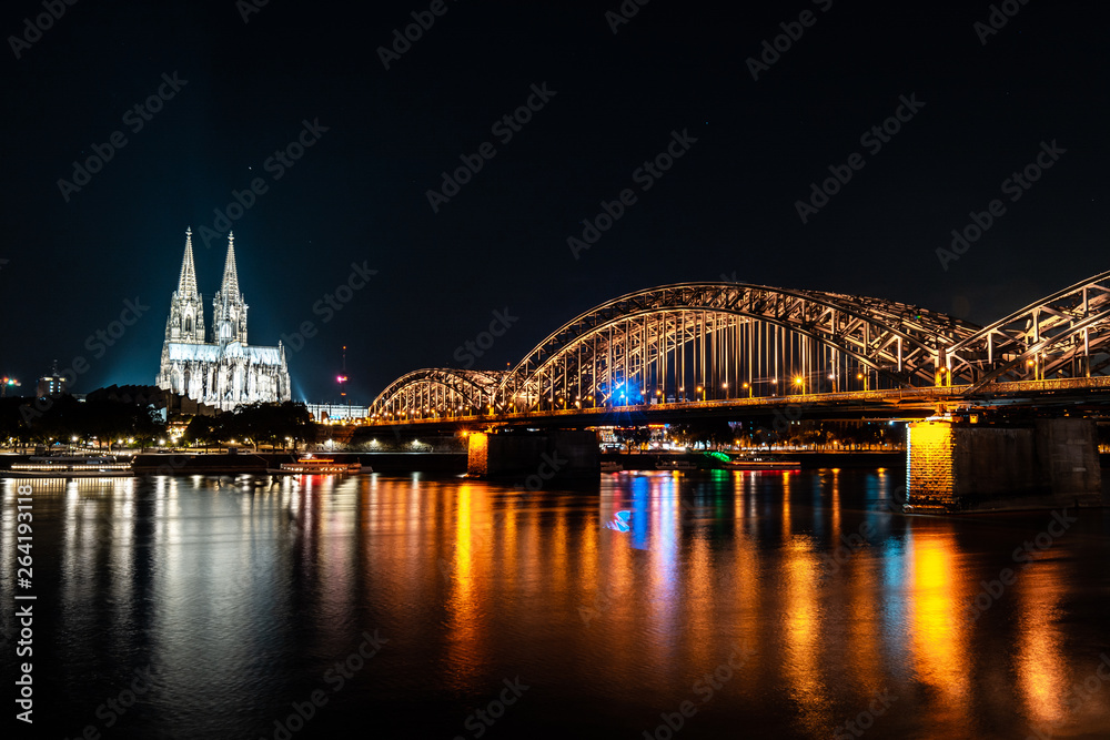Fototapeta premium Cologne (Köln) with bridge and cathedral at night 