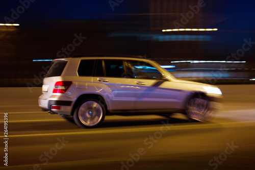 The car rushes on the highway at high speed Photo taken from the roadside ,Moscow, spring 2019, sky, car, road 