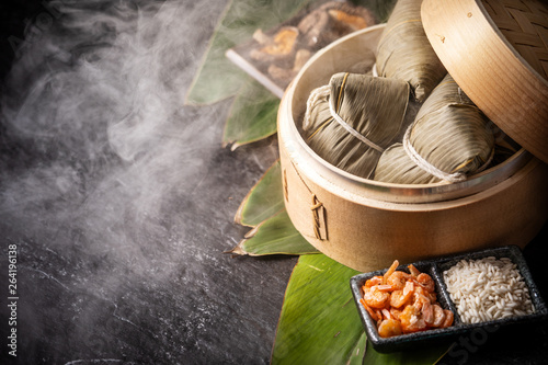 Zongzi, delicious fresh hot steamed rice dumplings in steamer. Close up, copy space, famous asian tasty food in dragon boat duanwu festival photo