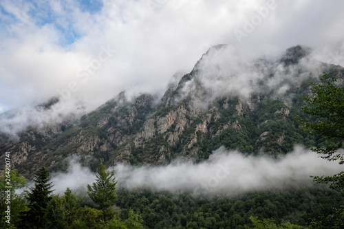 the mountains in the mist in Pyrenees, Occitanie, Orlu, France photo