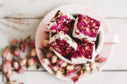 Lebanese sweets with edible flower petals. Nougat. Turkish delight with hibiscus