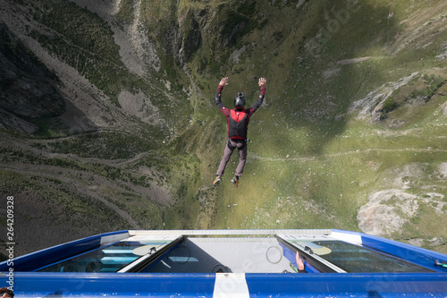 a man doing base jump with a parachute from a car at the pic du midi, Occitanie, Bagnères-de-Bigorre, France photo