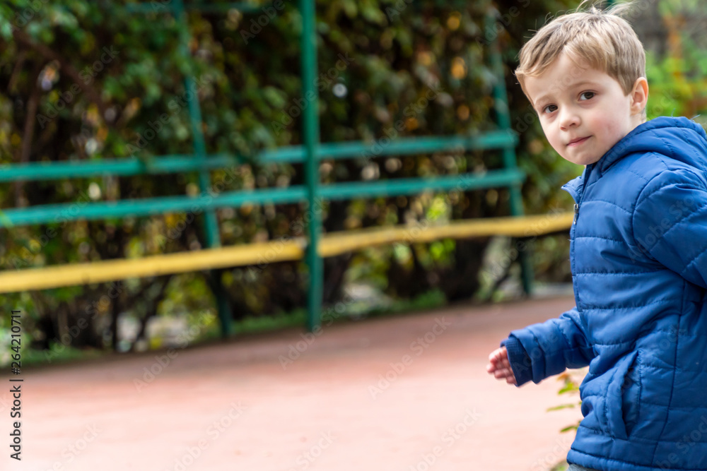 Fototapeta premium Small child running in a park
