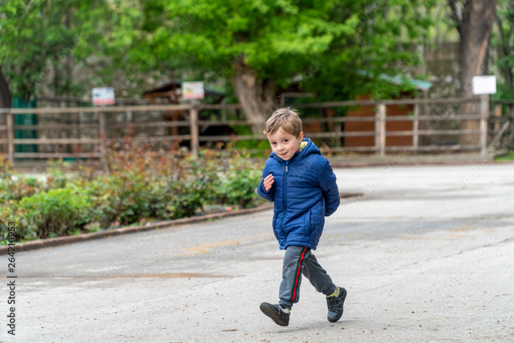 Small child running in a park Small child running in a park