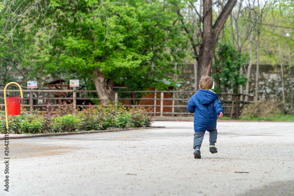 Small child running in a park Small child running in a park