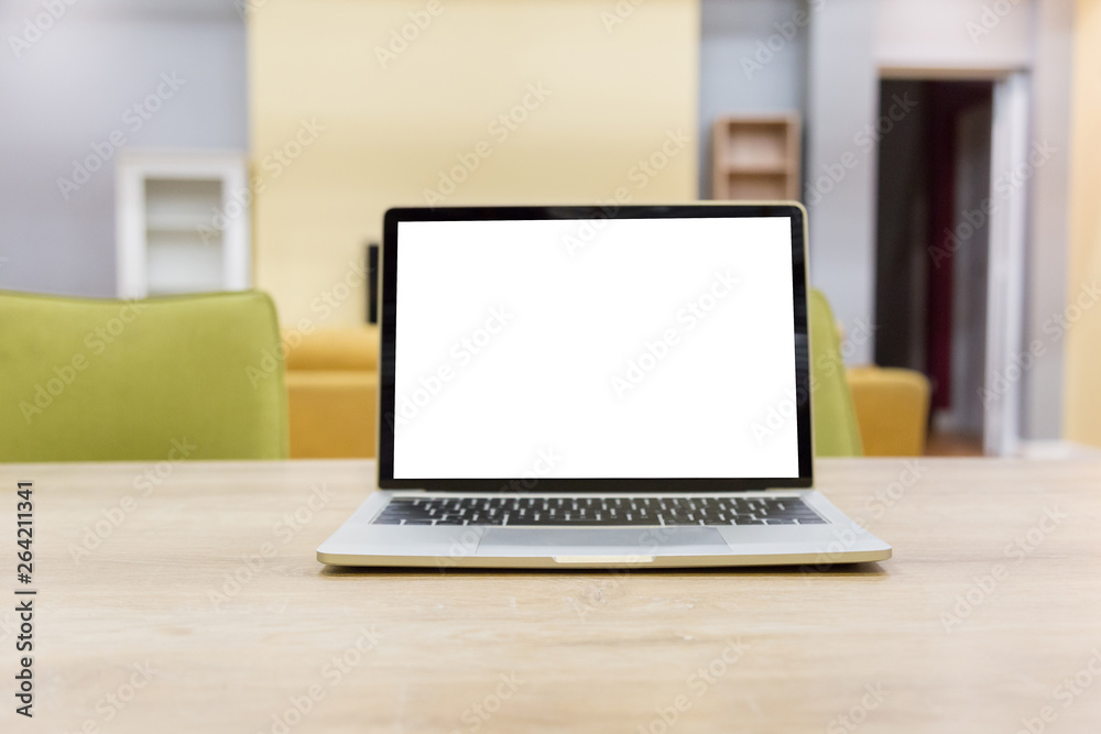 Fototapeta premium laptop showing blank screen on work table front view in home- Image