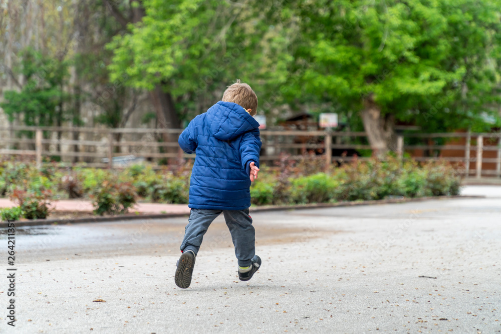 Small child running in a park Small child running in a park