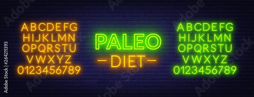Neon paleo diet sign on brick wall background. Neon alphabet .