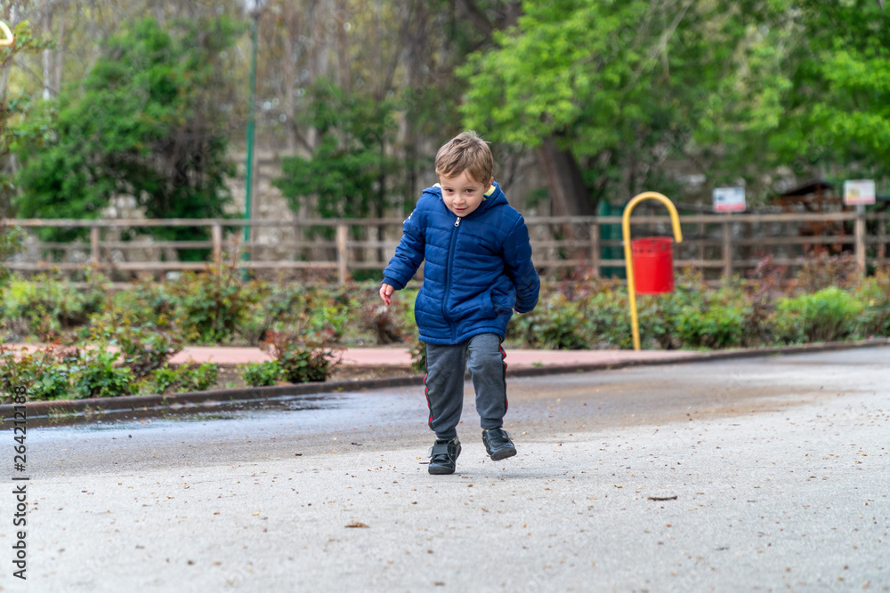 Small child running in a park Small child running in a park
