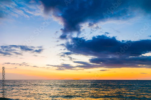 Colorful sunset sky on sea beach