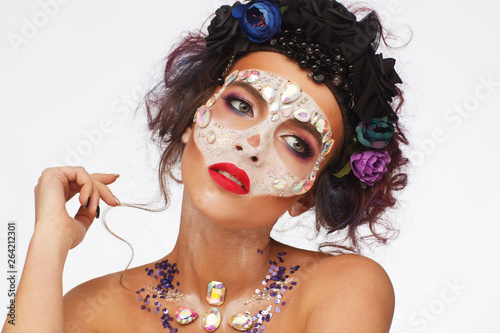 Portrait of a beautiful woman in creative expressive style photo