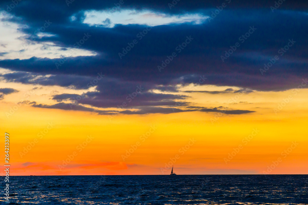 Colorful sunset sky on sea beach