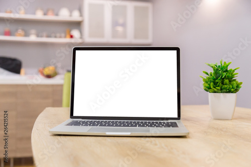 laptop showing blank screen on work table front view in home- Image