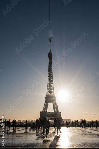 a man walk on a highline between Eiffel tower and Trocadero with people around, Île de France, Paris, France