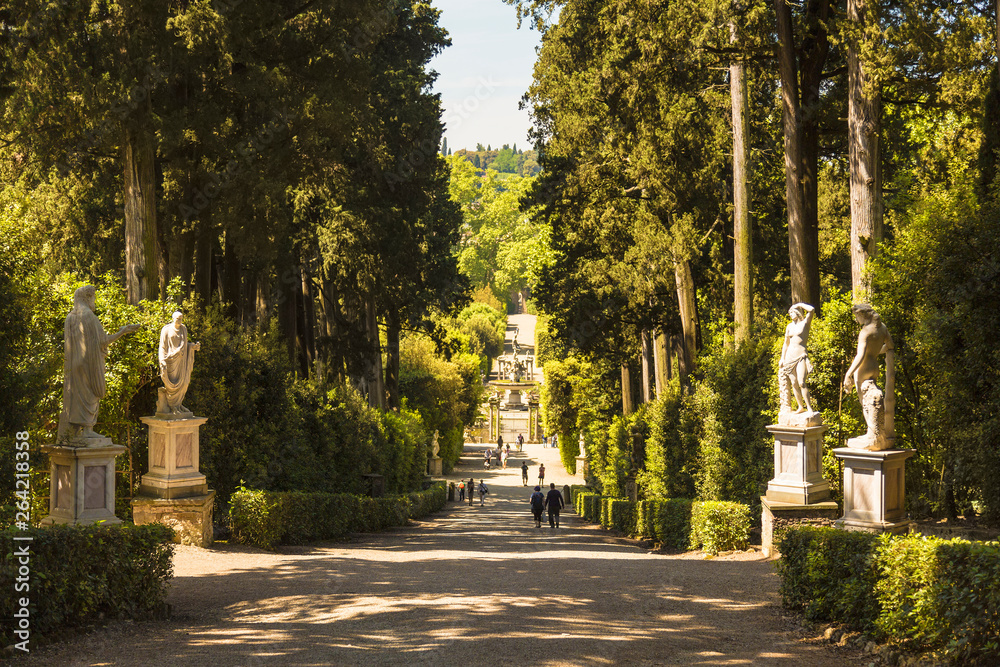 Park alley with statues in the Boboli gardens. Florence. Italy