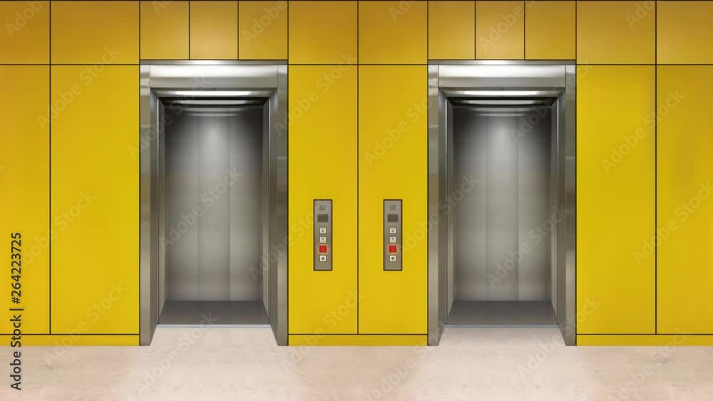 Sliding steel door elevator open showing lift interior. Office building with yellow walls.