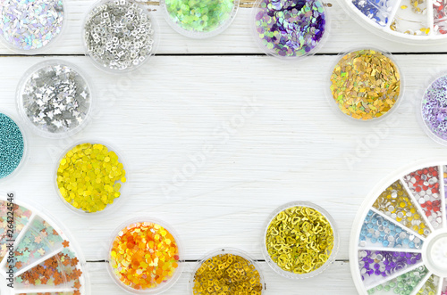 Wallpaper Mural Top view frame sequins on a white workplace with copy space in the middle Torontodigital.ca