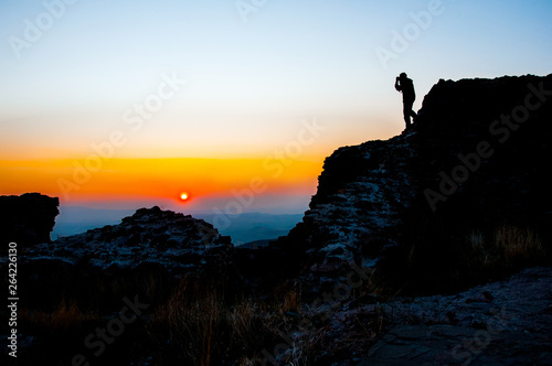 Skopje, Macedonia - november 2011. Mountain Vodno, tourists on the backdrop of the setting sun. © amtiko