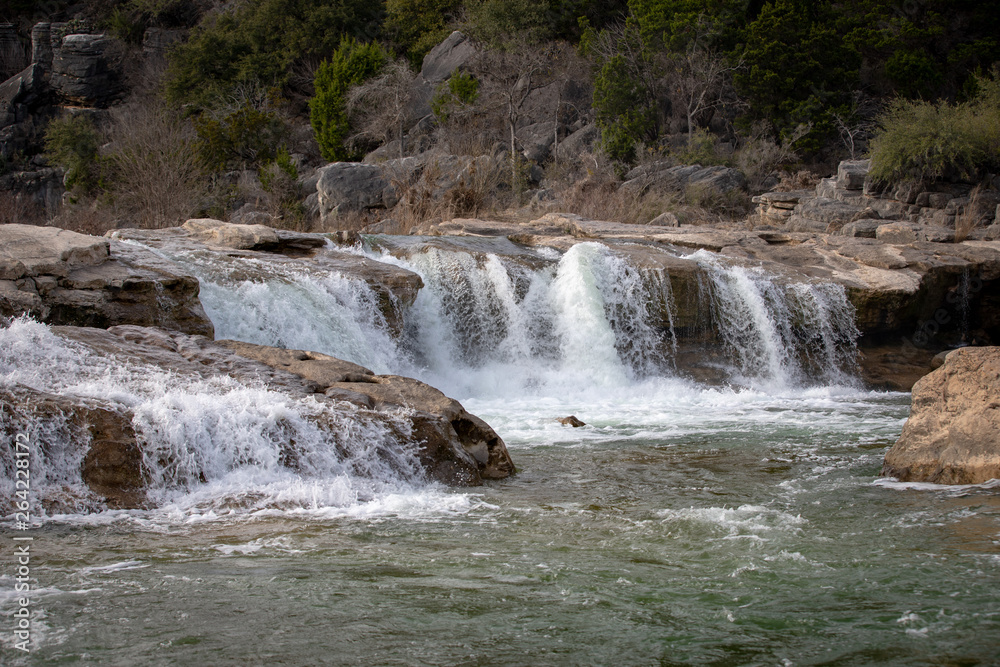 Obraz premium Scenic view of small waterfalls