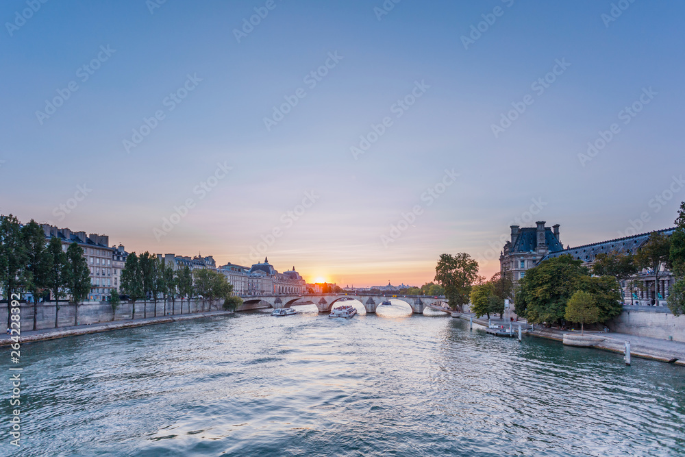 Obraz premium Sunset view of Seine river in Paris, France. Architecture and landmarks of Paris. Postcard of Paris