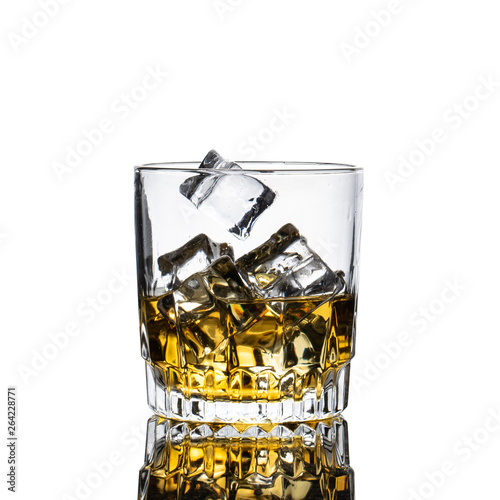 Whiskey Glass closeup, white background, with many ice cubes falling and splashing