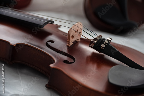 Closeup front side of violin,In selective focus at Fine Tuners,part of the instrument,classic style,vintage and art tone,blurry light around