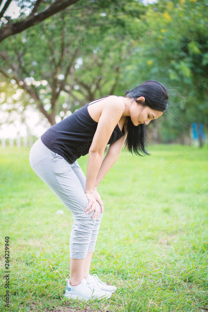 Young female warm up before exercise at the park Young female warm up before exercise at the park