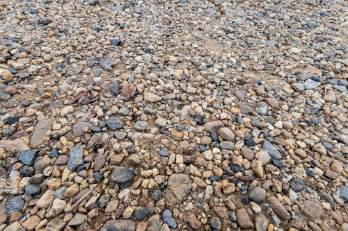 Colorful sand or pebble texture. Seamless texture on ground texture.