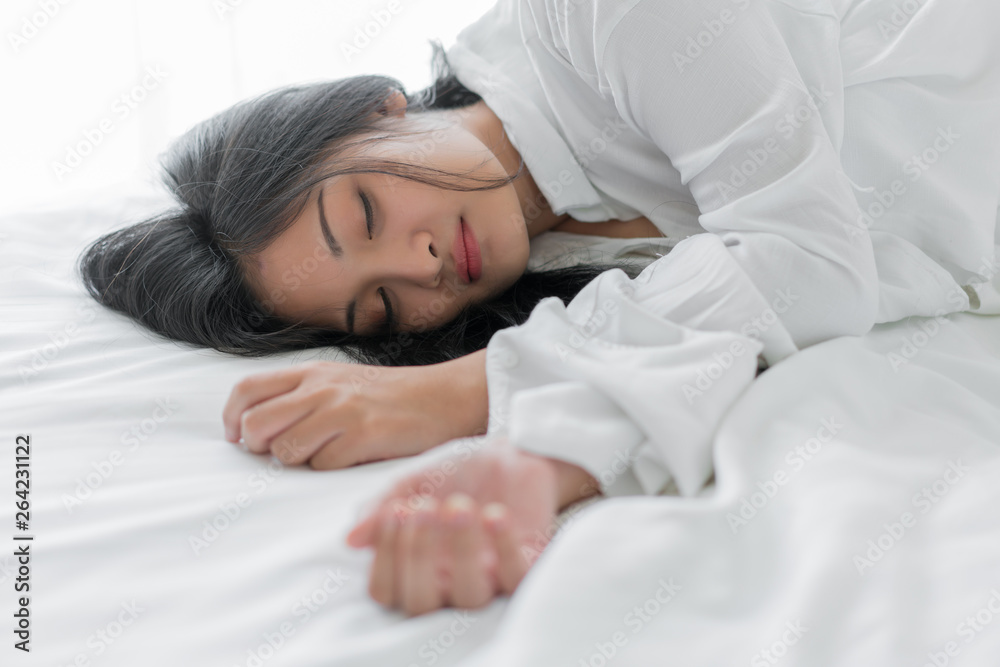 Beautiful young woman sleeping on bed at bedroom Beautiful young woman sleeping on bed at bedroom