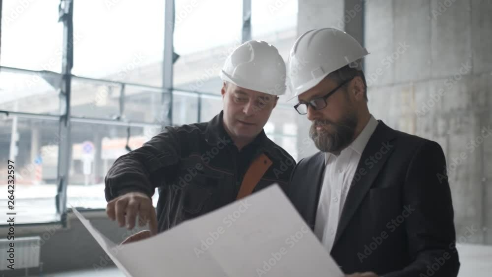 Two Engineers Meet At Construction And Consult Building Project. Two Engineers. 4k Two Engineers Meet At Construction And Consult Building Project. Two Engineers. 4k