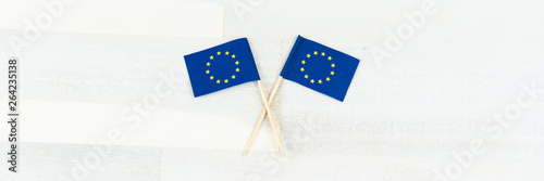 Two flags of the European Union, wood background, banner